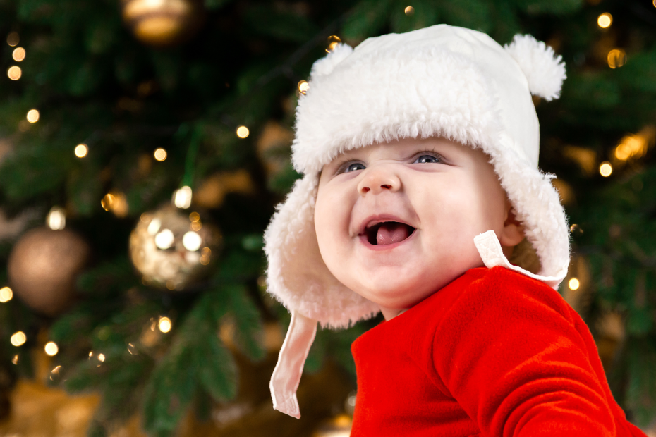 sleep at christmas with baby by Christmas tree