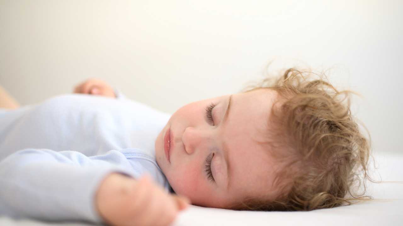 Baby sleepin cot after going through the baby sleep success course