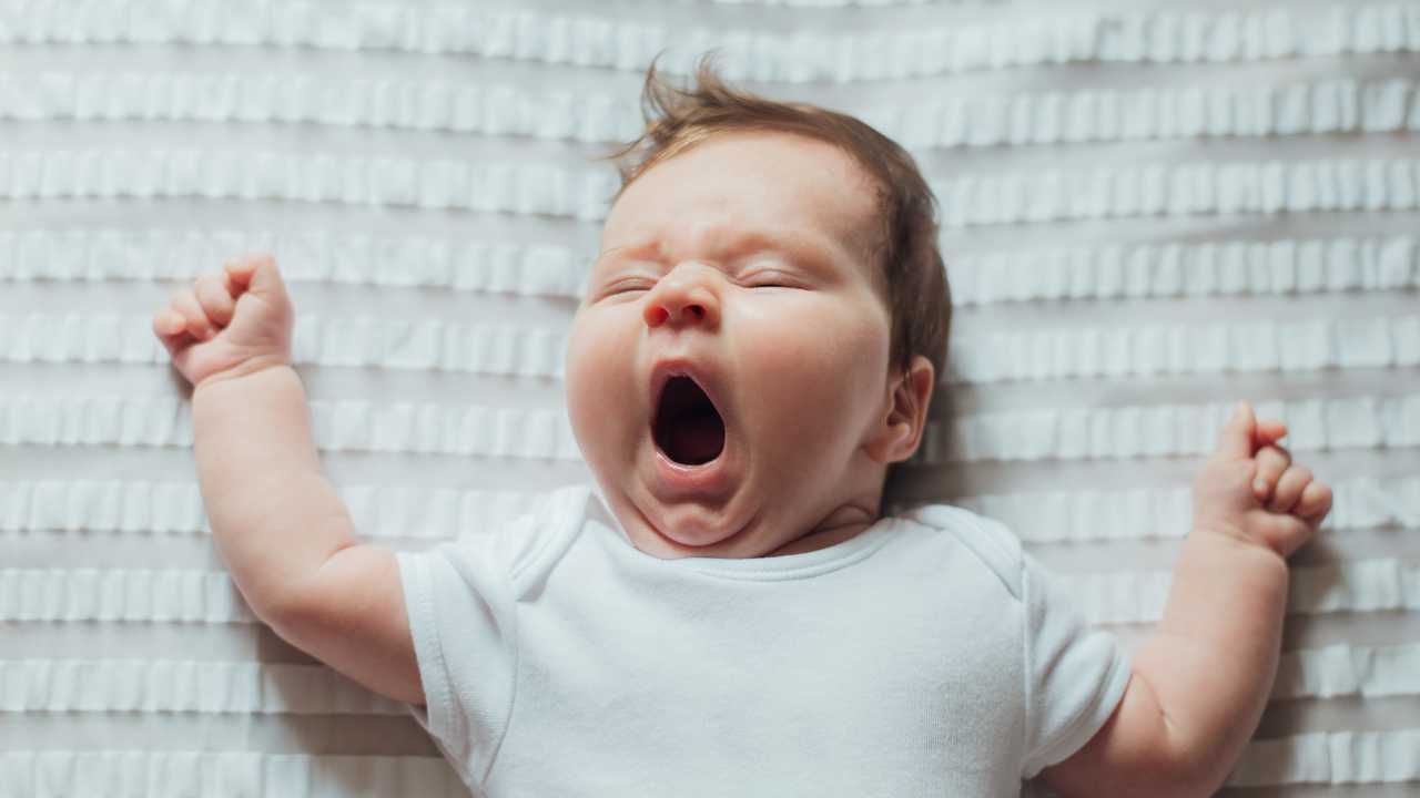 baby yawning after waking every hour through the night