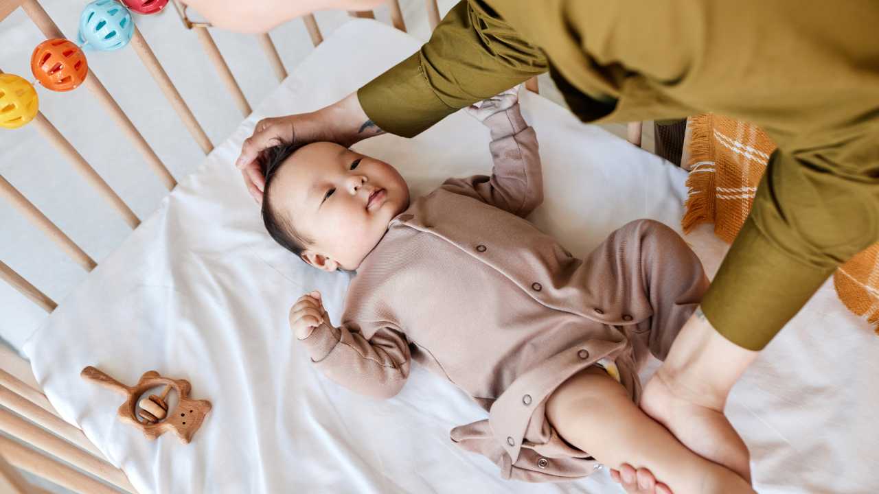 baby being stroked to sleep at bedtime