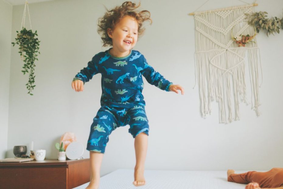toddler with fomo jumping on bed at bedtime