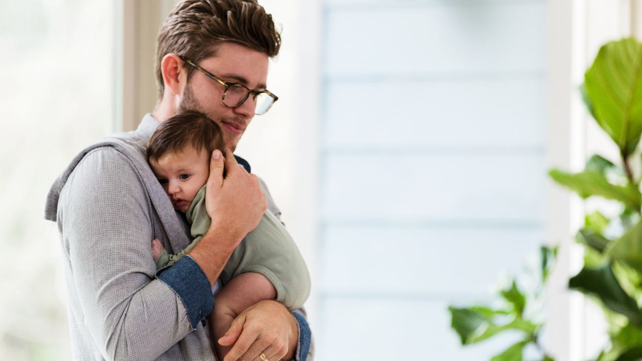 Dad and baby cuddling